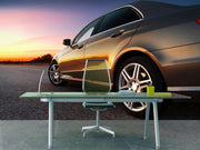 Rear-side view of a luxury car on sunset Wall Mural-Transportation-Eazywallz